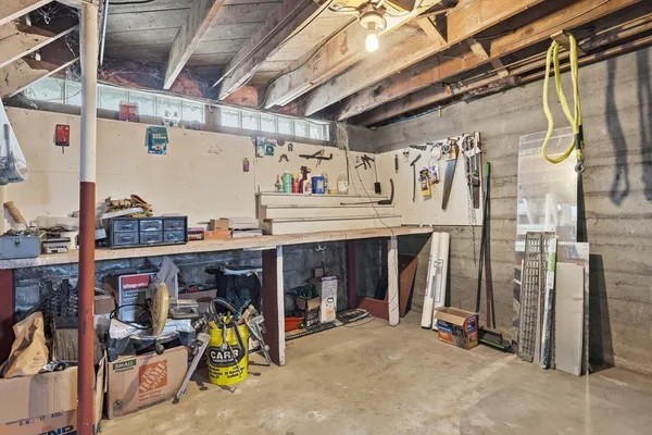 a bathroom with a sink mirror and shower