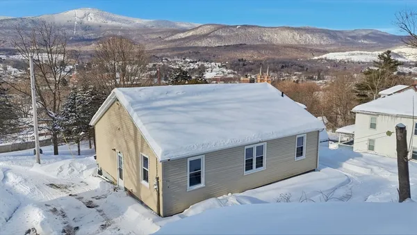 a view of a house with a mountain