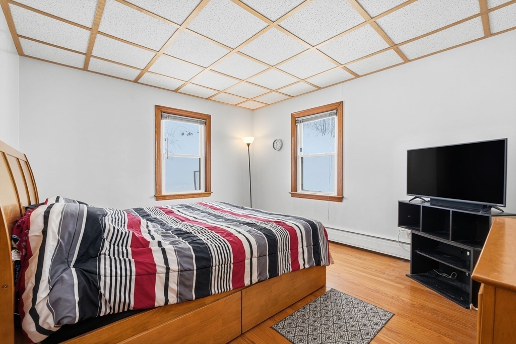 40 Victory Terrace Adams, MA 01220 - Photo 10 of 25 a bedroom with a bed and a flat screen tv