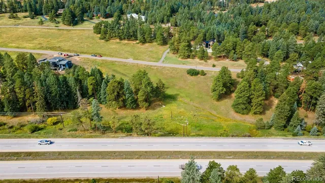 a view of a town with swimming pool and mountains