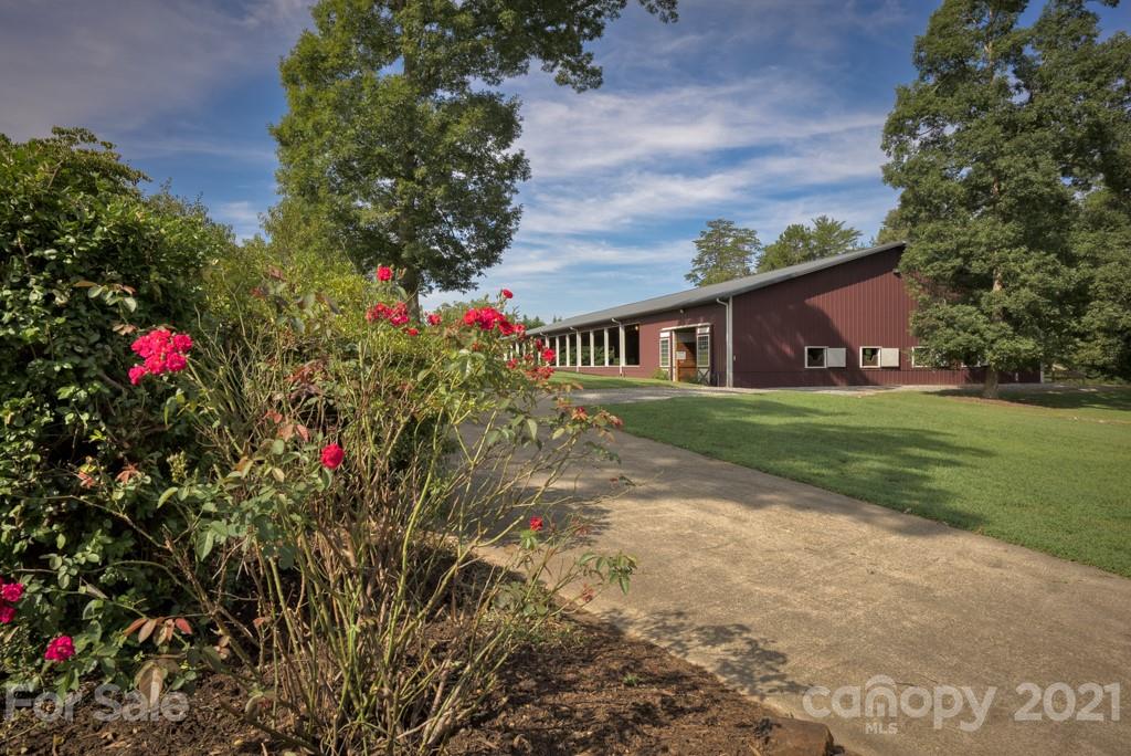 2667 Bill Collins Road Tryon, NC 28782 - Photo 21 of 48 a view of a house with a yard and garden