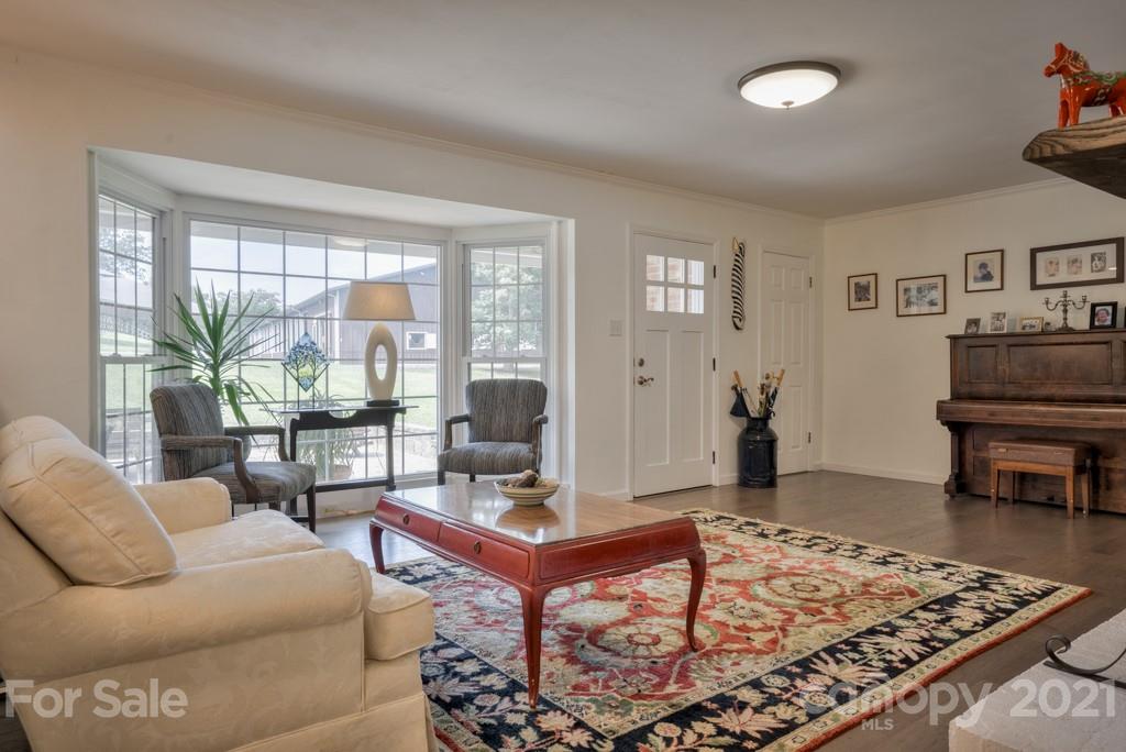 2667 Bill Collins Road Tryon, NC 28782 - Photo 24 of 48 a living room with furniture and a rug