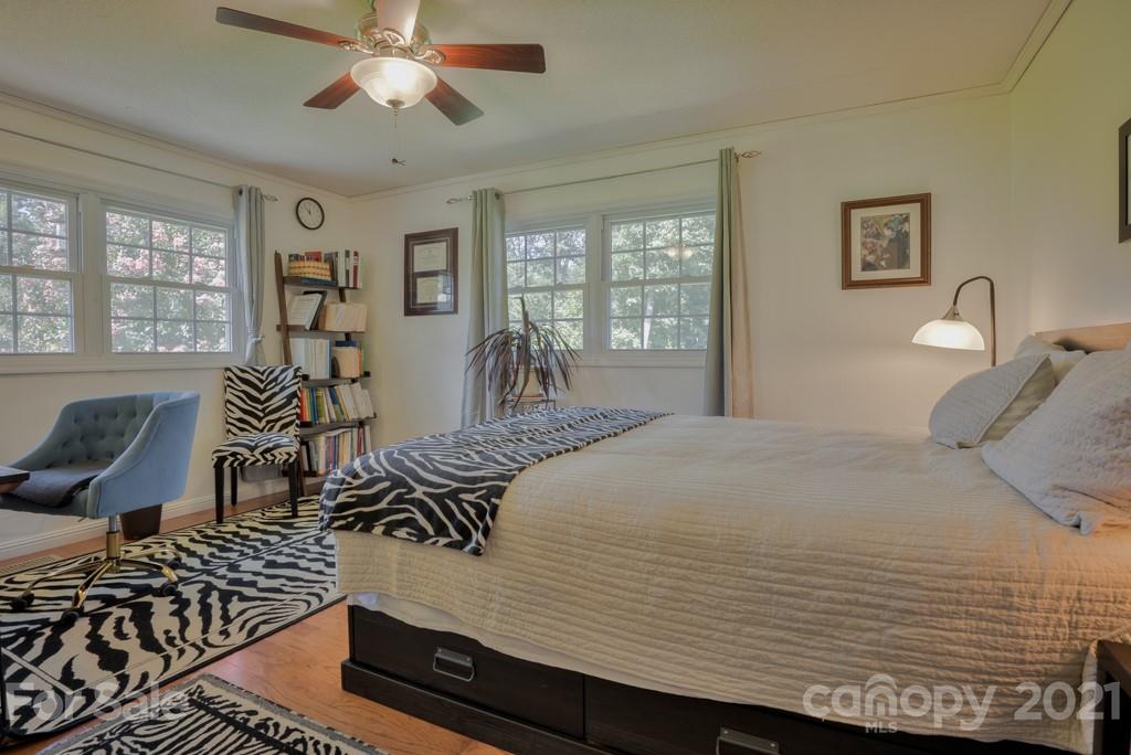 2667 Bill Collins Road Tryon, NC 28782 - Photo 39 of 48 a bedroom with a bed and wooden floor