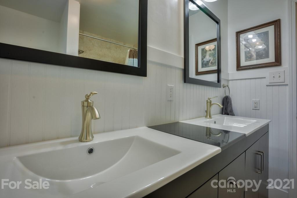2667 Bill Collins Road Tryon, NC 28782 - Photo 41 of 48 a bathroom with a sink and a mirror