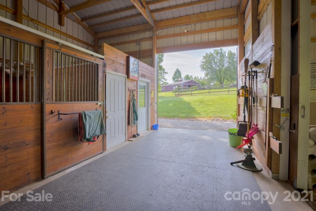 2667 Bill Collins Road Tryon, NC 28782 - Photo 8 of 48 a view of a porch with furniture and garden