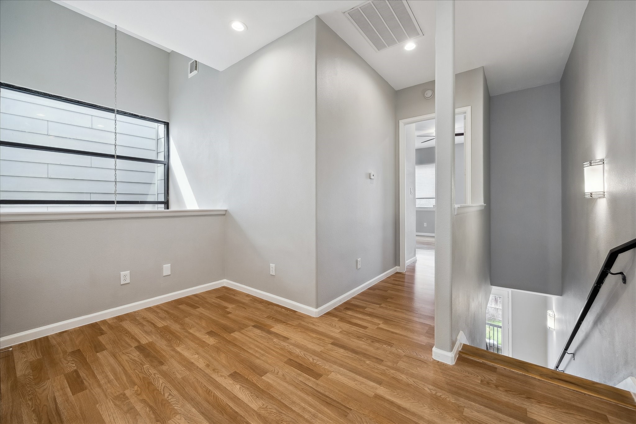 802 Waverly Street, Unit D Houston, TX 77007 - Photo 18 of 30 a view of empty room with wooden floor and window