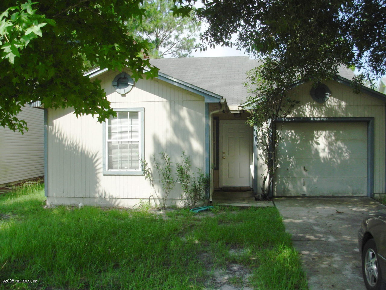 2440 Spring Vale Road Jacksonville, FL 32246 - Photo 1 of 7 a view of backyard of house