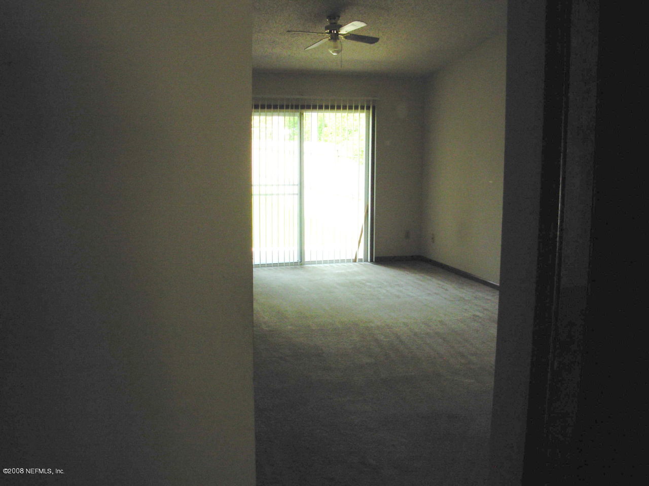 2440 Spring Vale Road Jacksonville, FL 32246 - Photo 2 of 7 a view of an empty room and a window