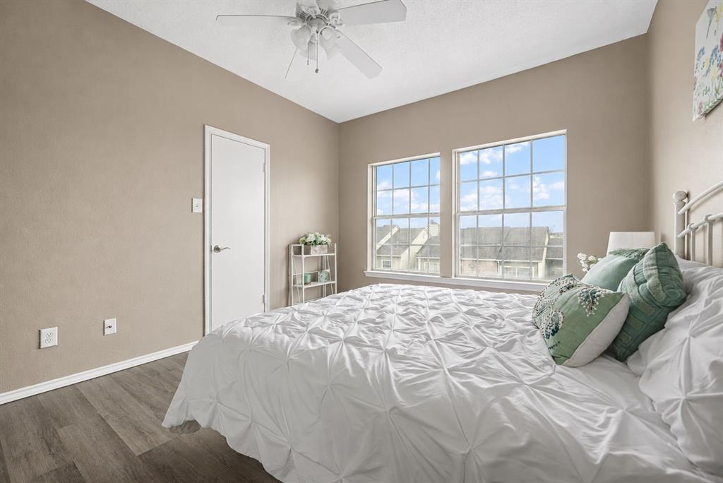 4113 Esters Road, Unit 609 Irving, TX 75038 - Photo 12 of 18 a bedroom with a bed and glass window