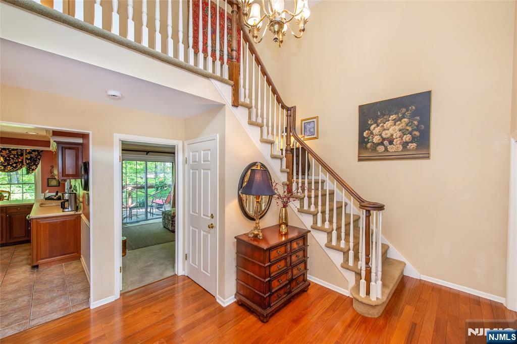 8 Tomahawk Drive Wayne, NJ 07470 - Photo 16 of 35 a view of staircase with furniture and a window