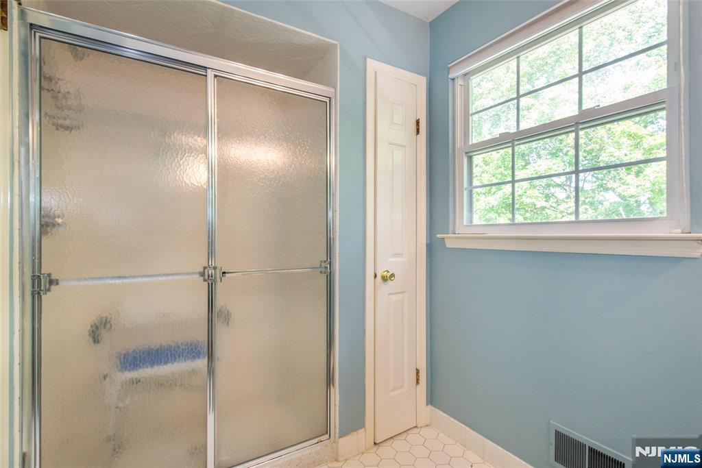 8 Tomahawk Drive Wayne, NJ 07470 - Photo 21 of 35 a view of an empty room with a window