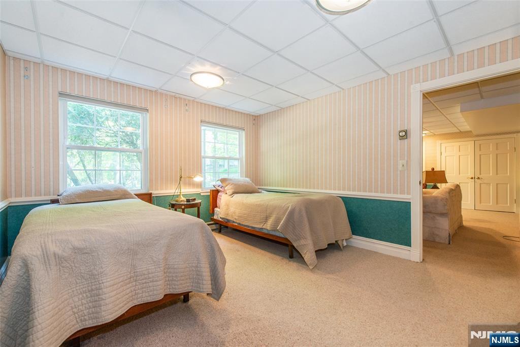 8 Tomahawk Drive Wayne, NJ 07470 - Photo 25 of 35 a bedroom with a bed and a window