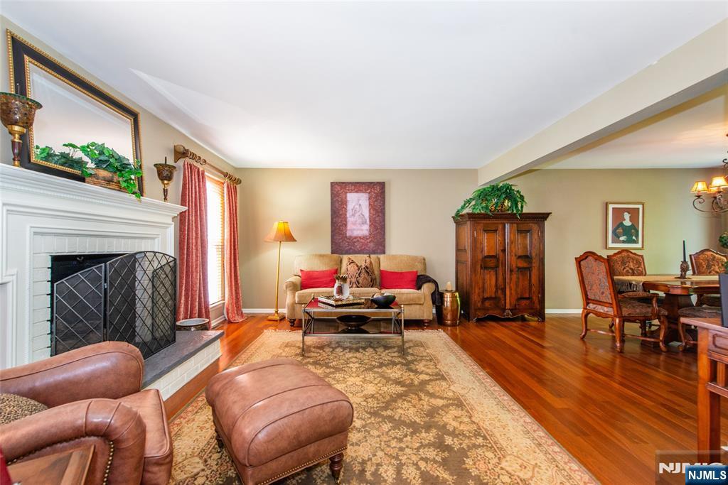 8 Tomahawk Drive Wayne, NJ 07470 - Photo 4 of 35 a living room with furniture and a fireplace