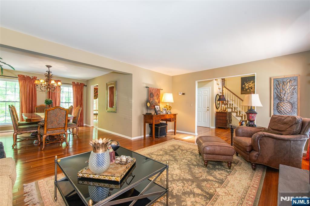 8 Tomahawk Drive Wayne, NJ 07470 - Photo 5 of 35 a living room with furniture and wooden floor