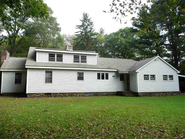 558 Leadmine Road Sturbridge, MA 01566 - Photo 3 of 15 a front view of a house with a garden
