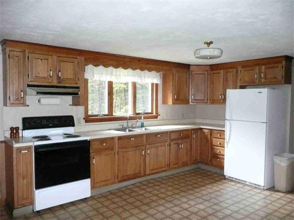 558 Leadmine Road Sturbridge, MA 01566 - Photo 8 of 15 a kitchen with a sink stove and refrigerator