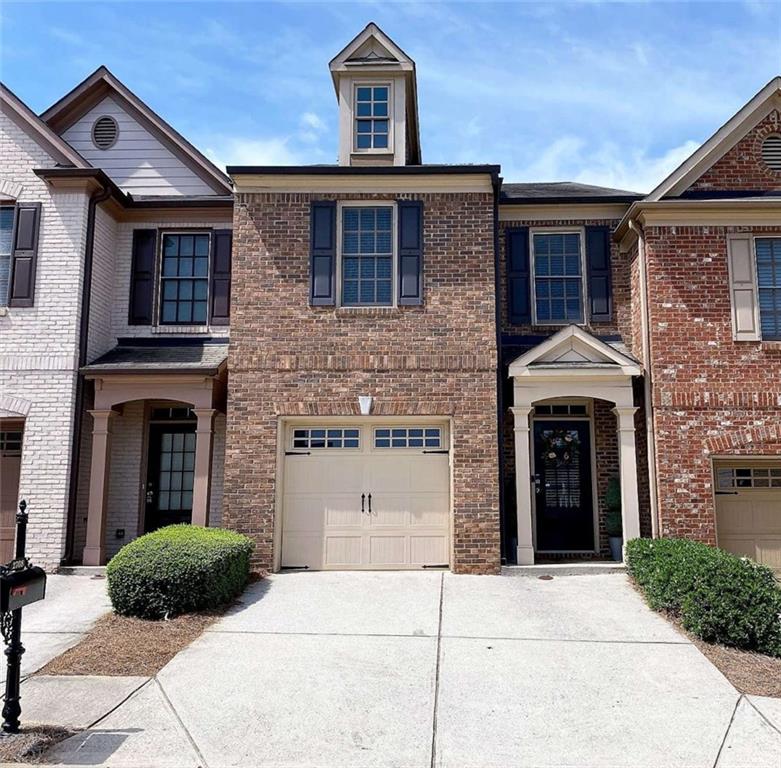2708 Beynon Lane Northeast Suwanee, GA 30024 - Photo 1 of 38 a view of building with a outdoor space