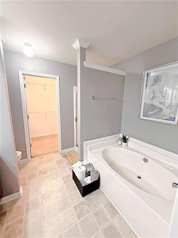 2708 Beynon Lane Northeast Suwanee, GA 30024 - Photo 19 of 38 a bathroom with a tub sink and mirror