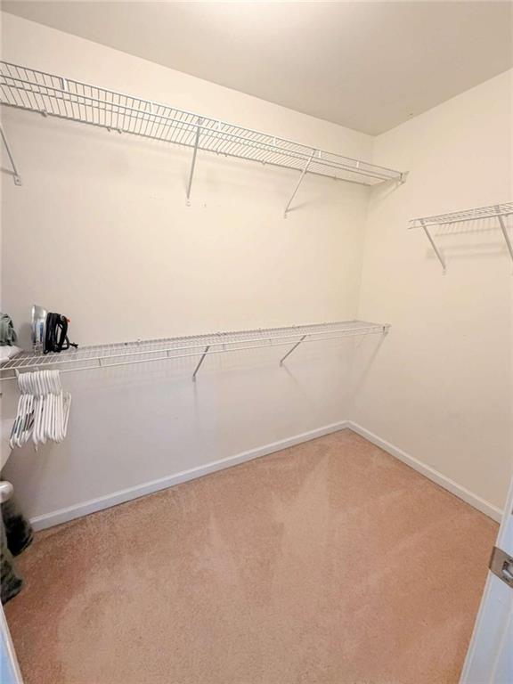 2708 Beynon Lane Northeast Suwanee, GA 30024 - Photo 20 of 38 a view of a room with racks on the wall