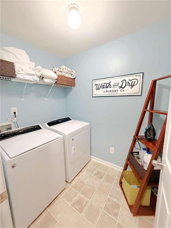 2708 Beynon Lane Northeast Suwanee, GA 30024 - Photo 22 of 38 a utility room with dryer and washer