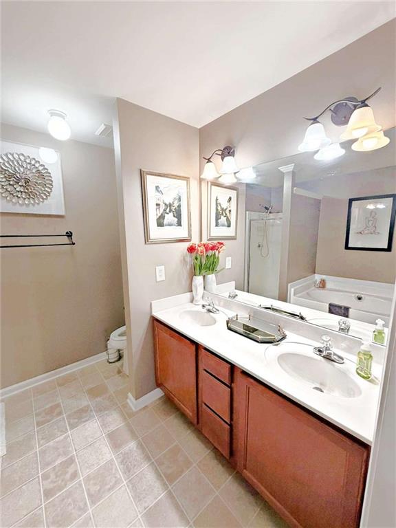 2708 Beynon Lane Northeast Suwanee, GA 30024 - Photo 28 of 38 a bathroom with a sink vanity and mirror