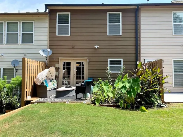 a front view of a house with garden and porch