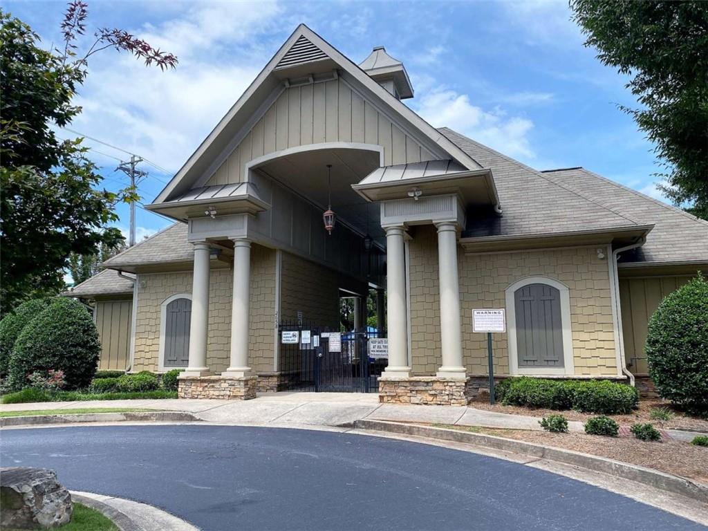 2708 Beynon Lane Northeast Suwanee, GA 30024 - Photo 33 of 38 a front view of a house with a yard and garage