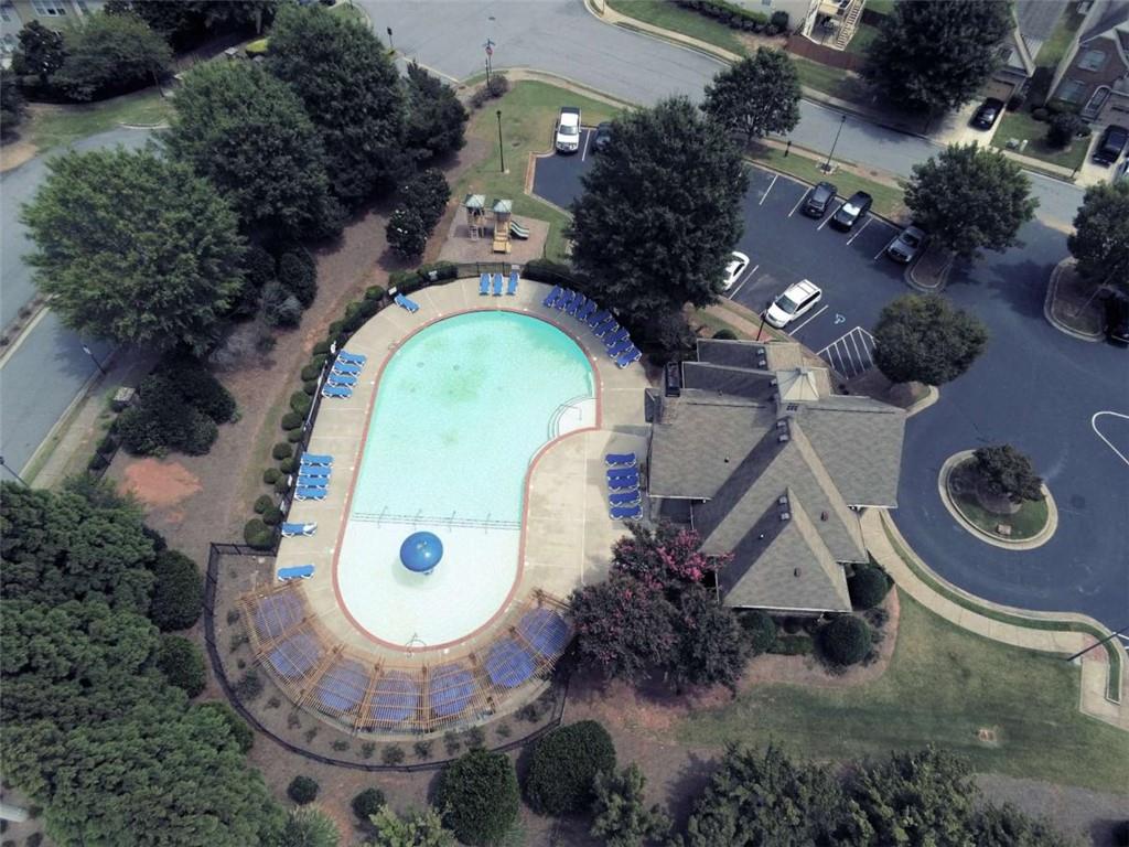 2708 Beynon Lane Northeast Suwanee, GA 30024 - Photo 35 of 38 an aerial view of a house with garden space swimming pool and outdoor seating
