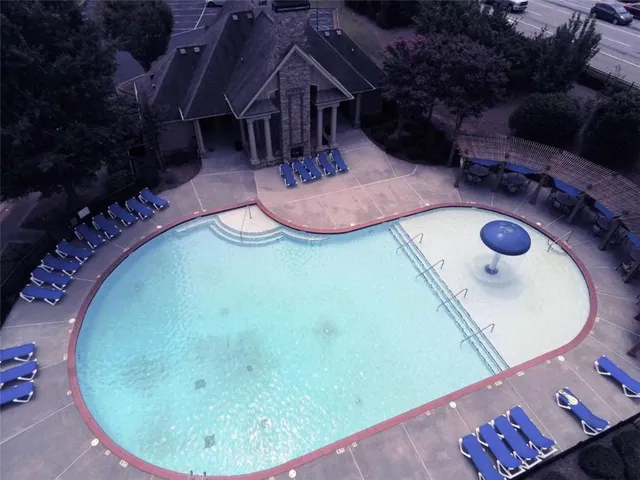 a view of a house with a yard and sitting area