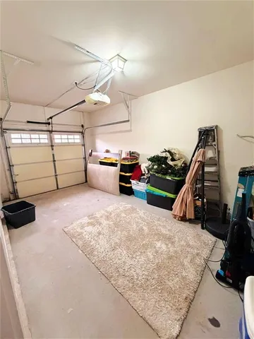 a bedroom with furniture and a flat screen tv