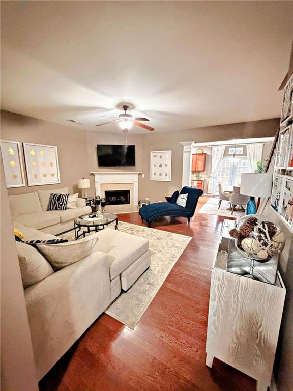 2708 Beynon Lane Northeast Suwanee, GA 30024 - Photo 6 of 38 a living room with furniture and a flat screen tv