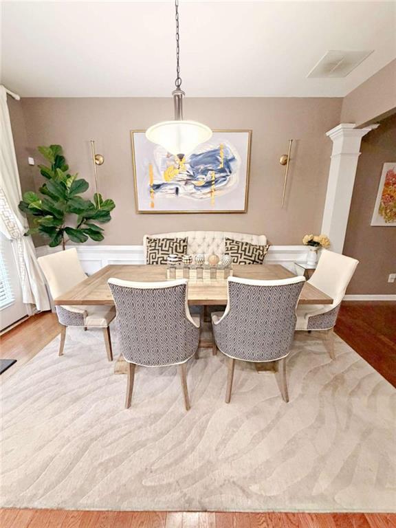 2708 Beynon Lane Northeast Suwanee, GA 30024 - Photo 9 of 38 a living room with a couch and a potted plant