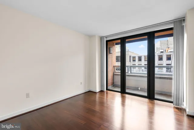 an empty room with wooden floor