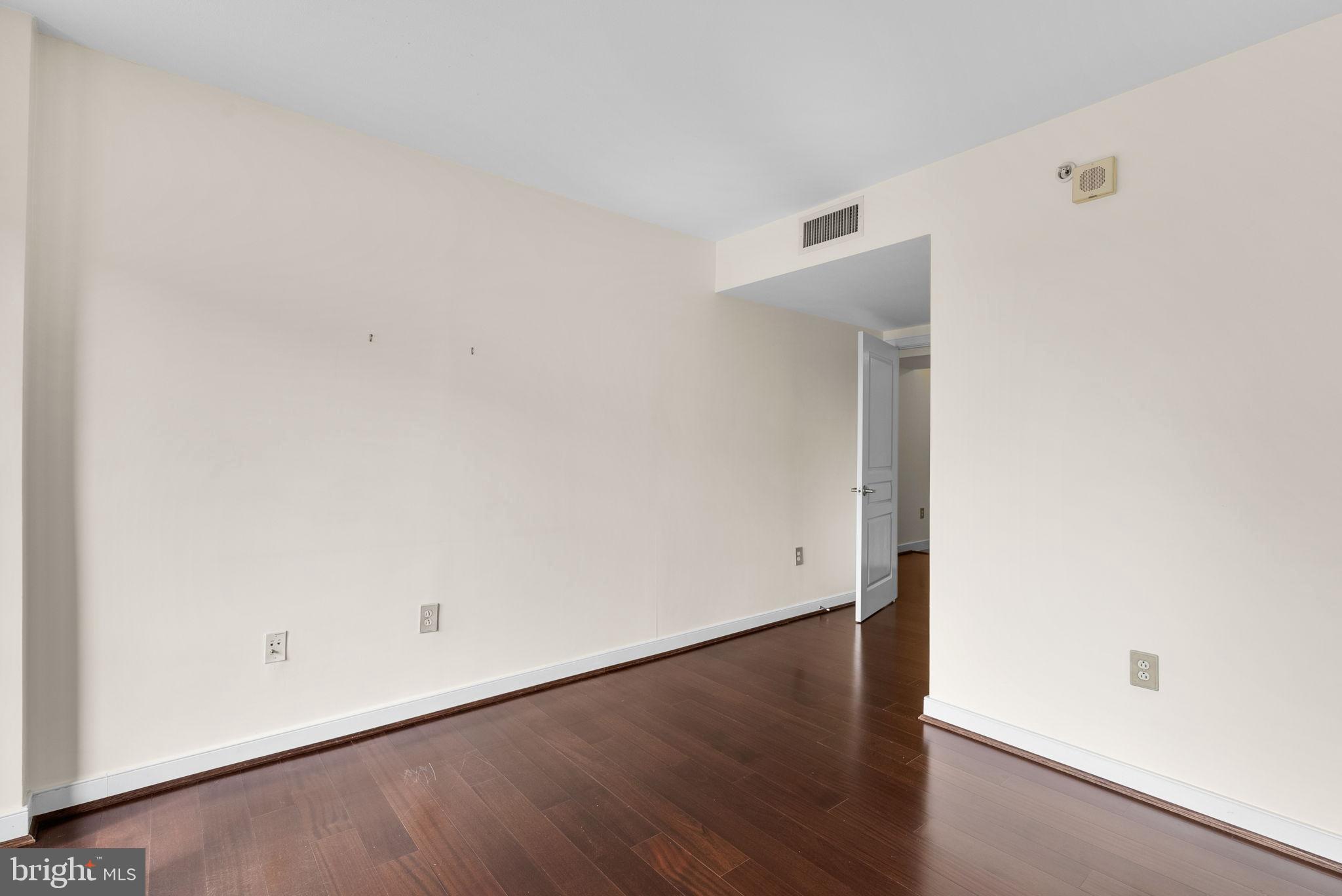 631 D Street Northwest, Unit 1129 Washington, DC 20004 - Photo 23 of 29 an empty room with wooden floor