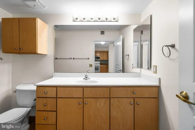 a bathroom with a toilet a sink and bathtub