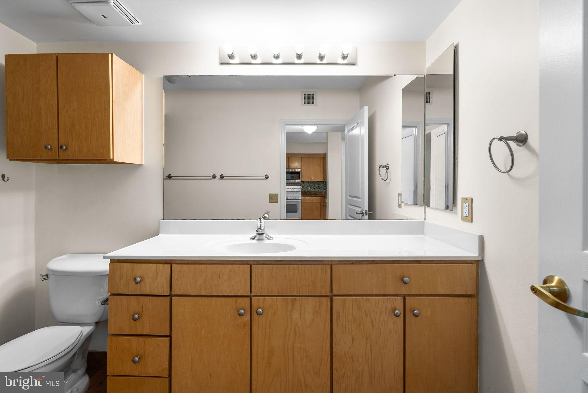 631 D Street Northwest, Unit 1129 Washington, DC 20004 - Photo 25 of 29 a bathroom with a sink and a mirror