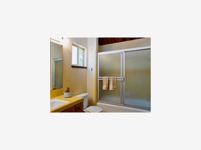 127 Sunset Terrace Scotts Valley, CA 95066 - Photo 5 of 9 a en suite bathroom with a sink and mirror