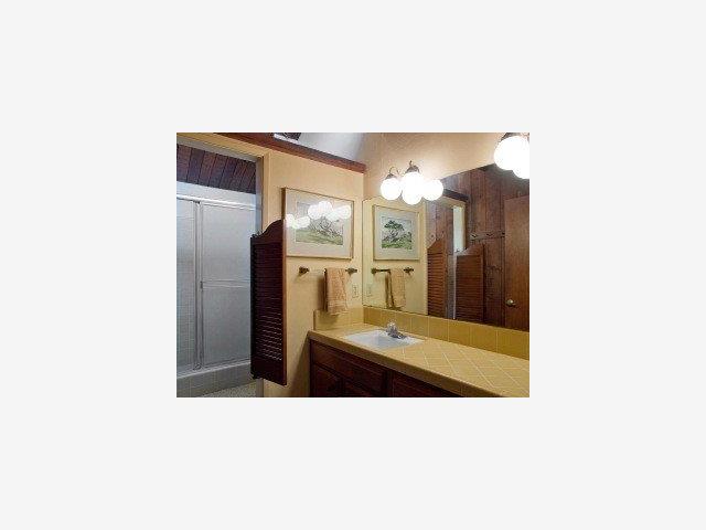 127 Sunset Terrace Scotts Valley, CA 95066 - Photo 6 of 9 a bathroom with a sink and a mirror