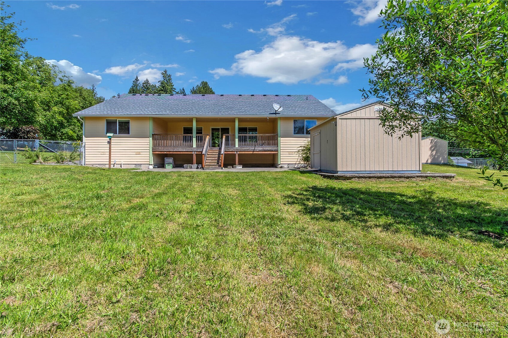 1450 Southeast Spruce Road Port Orchard, WA 98367 - Photo 32 of 39 a view of a house with a yard