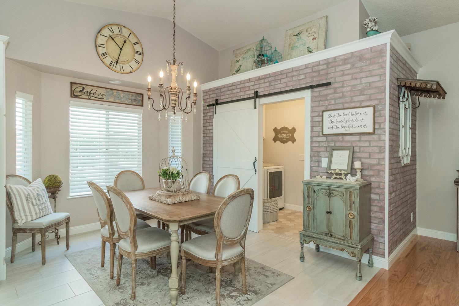 2508 Gibson Avenue Clovis, CA 93611 - Photo 11 of 33 a view of a dining room with furniture and chandelier