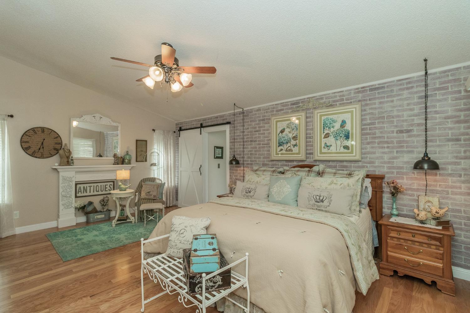 2508 Gibson Avenue Clovis, CA 93611 - Photo 14 of 33 a bedroom with a bed a table and chair