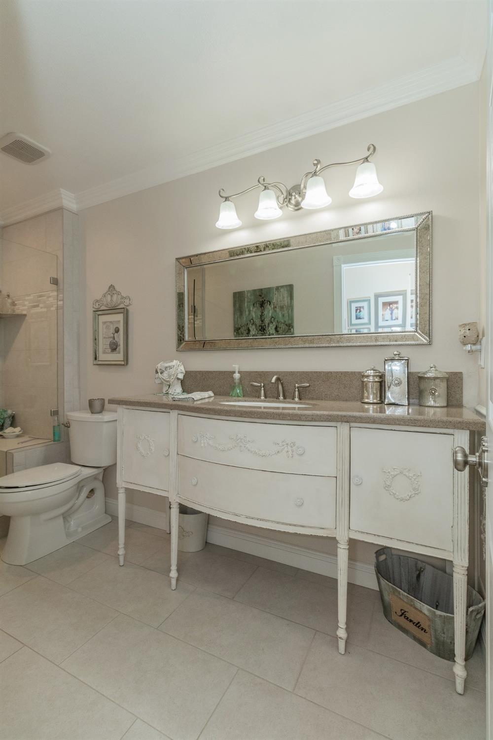 2508 Gibson Avenue Clovis, CA 93611 - Photo 20 of 33 a bathroom with a sink and a large mirror