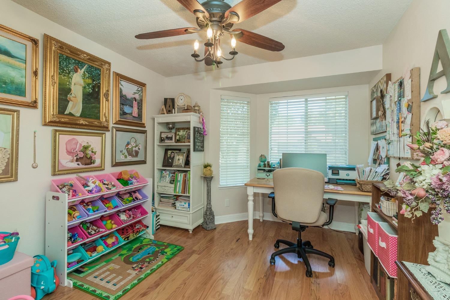 2508 Gibson Avenue Clovis, CA 93611 - Photo 23 of 33 a workspace with furniture and toys