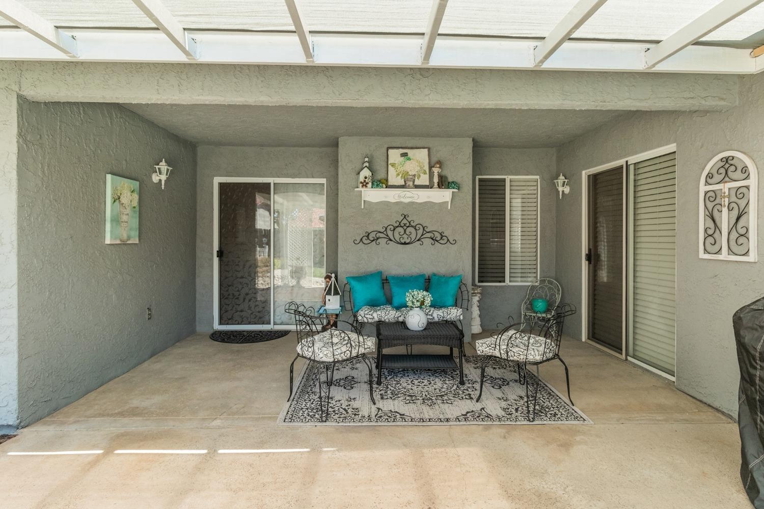 2508 Gibson Avenue Clovis, CA 93611 - Photo 24 of 33 a living room with furniture and a table