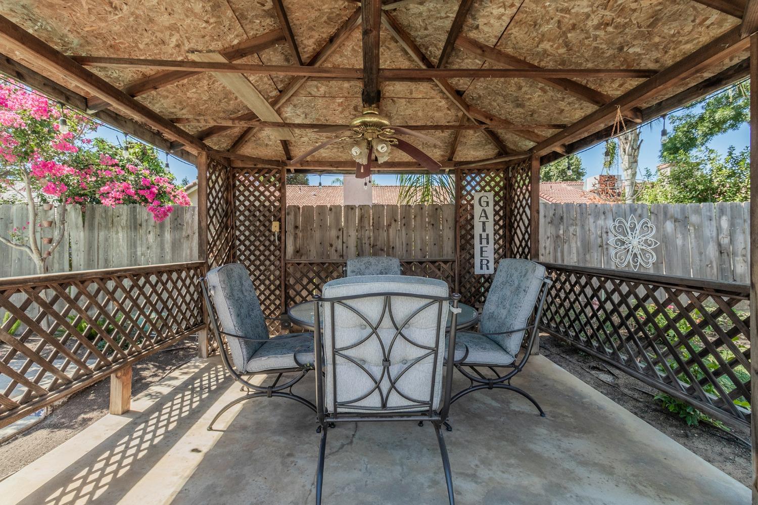 2508 Gibson Avenue Clovis, CA 93611 - Photo 26 of 33 a view of a chairs and table in the backyard