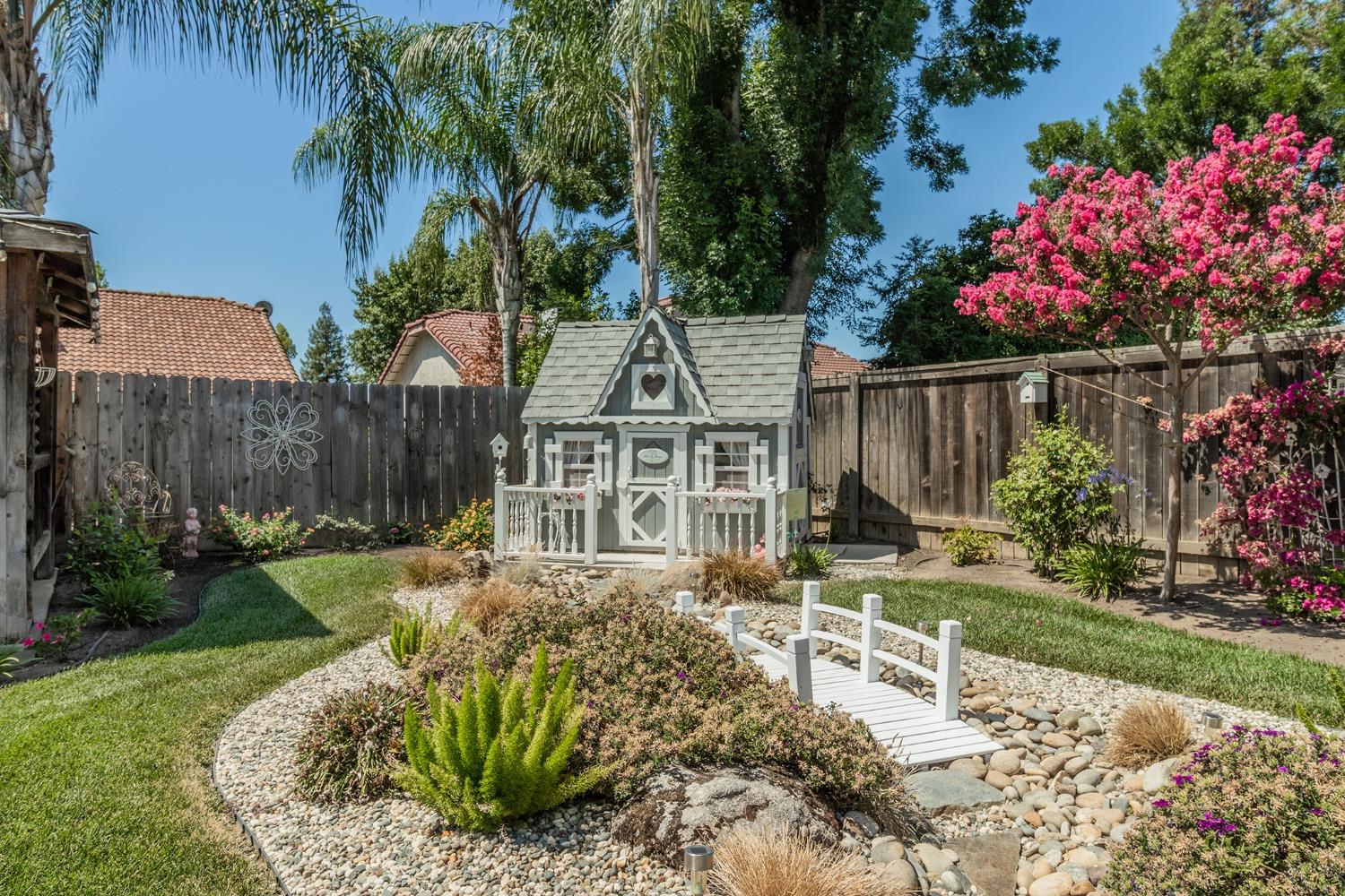 2508 Gibson Avenue Clovis, CA 93611 - Photo 27 of 33 a view of a chair and table in the garden