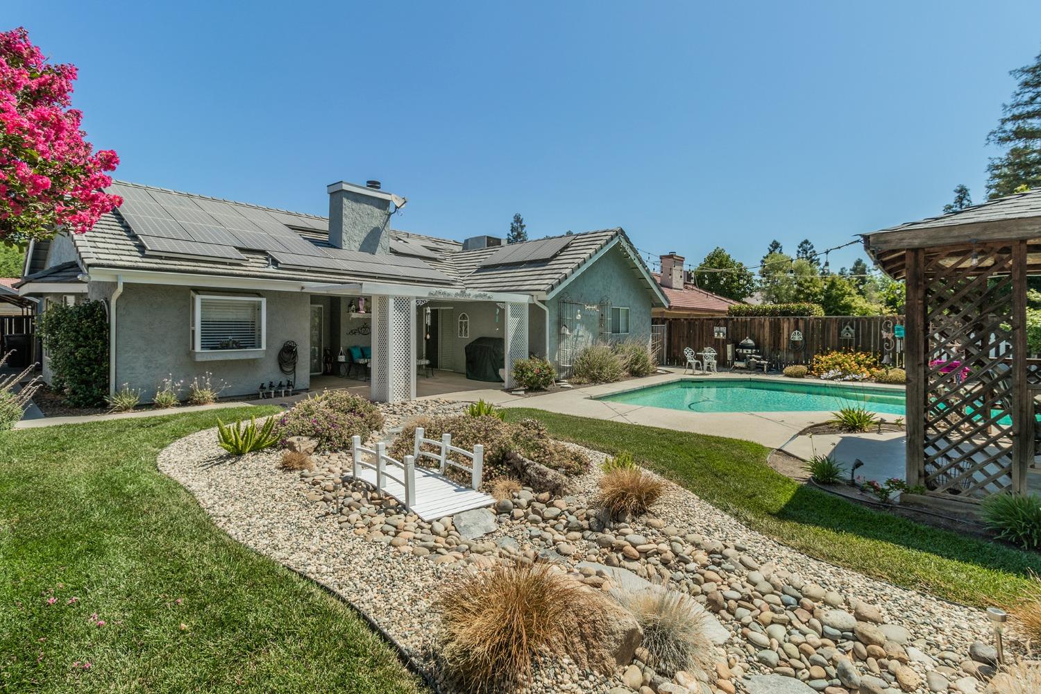 2508 Gibson Avenue Clovis, CA 93611 - Photo 28 of 33 a front view of a house with garden