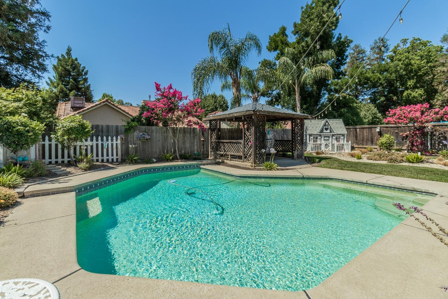 2508 Gibson Avenue Clovis, CA 93611 - Photo 29 of 33 a view of a house with backyard porch and sitting area