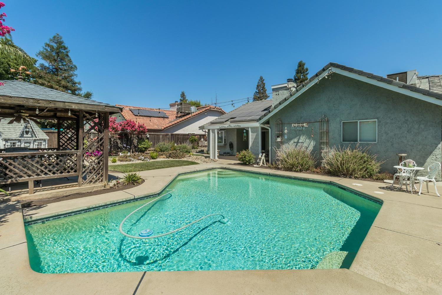 2508 Gibson Avenue Clovis, CA 93611 - Photo 30 of 33 a view of a house with swimming pool