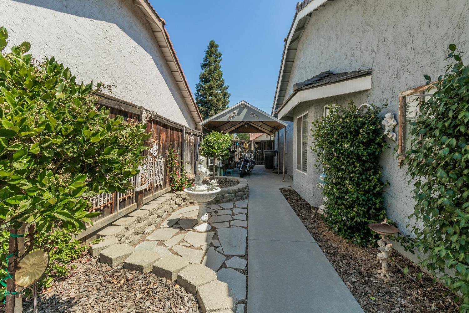 2508 Gibson Avenue Clovis, CA 93611 - Photo 31 of 33 a view of a backyard with potted plants